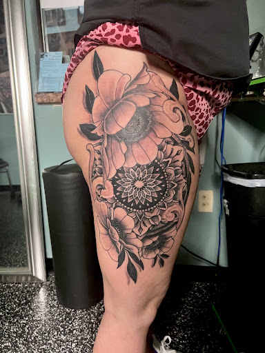 Explore ankle flower tattoo ideas, creative tattoo ideas in Meridian, available at Creative Pain Tattoo Studio