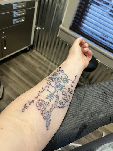 Explore above knee tattoo ideas, creative tattoo ideas in Allegan, available at Doghouse Crue Tattoos