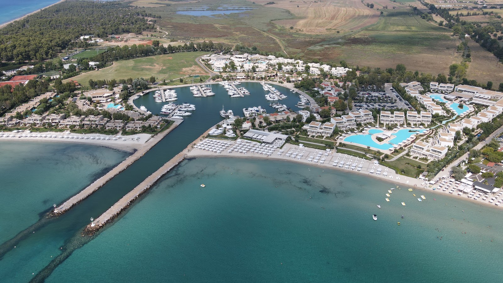 Photo of Sani beach III with turquoise pure water surface