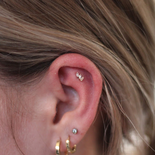 Explore filler ideas for sleeve tattoos, creative tattoo ideas in Toledo, available at Piercings by Caitlin presents Holier Toledo