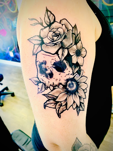 Explore music sleeve tattoo ideas, creative tattoo ideas in Lake City, available at Crooked Spines Tattoo Studio