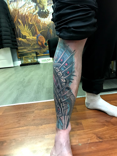 Explore arm cross tattoo ideas, creative tattoo ideas in Girard, available at Empress Tattoos FKA Treehouse Tattoo