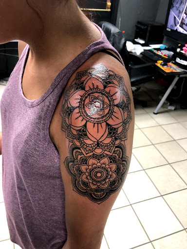 Find sunflower tattoo ideas for females for your next unique tattoo in Bridgeport at Evolution Tattoo