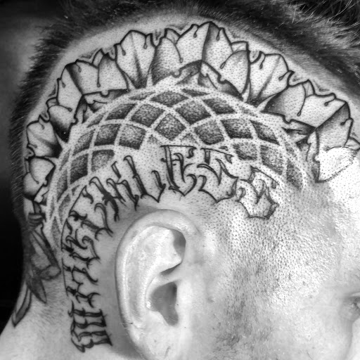 Explore lab tattoo ideas, creative tattoo ideas in Ridge, available at Masquerade Tattoo Shop