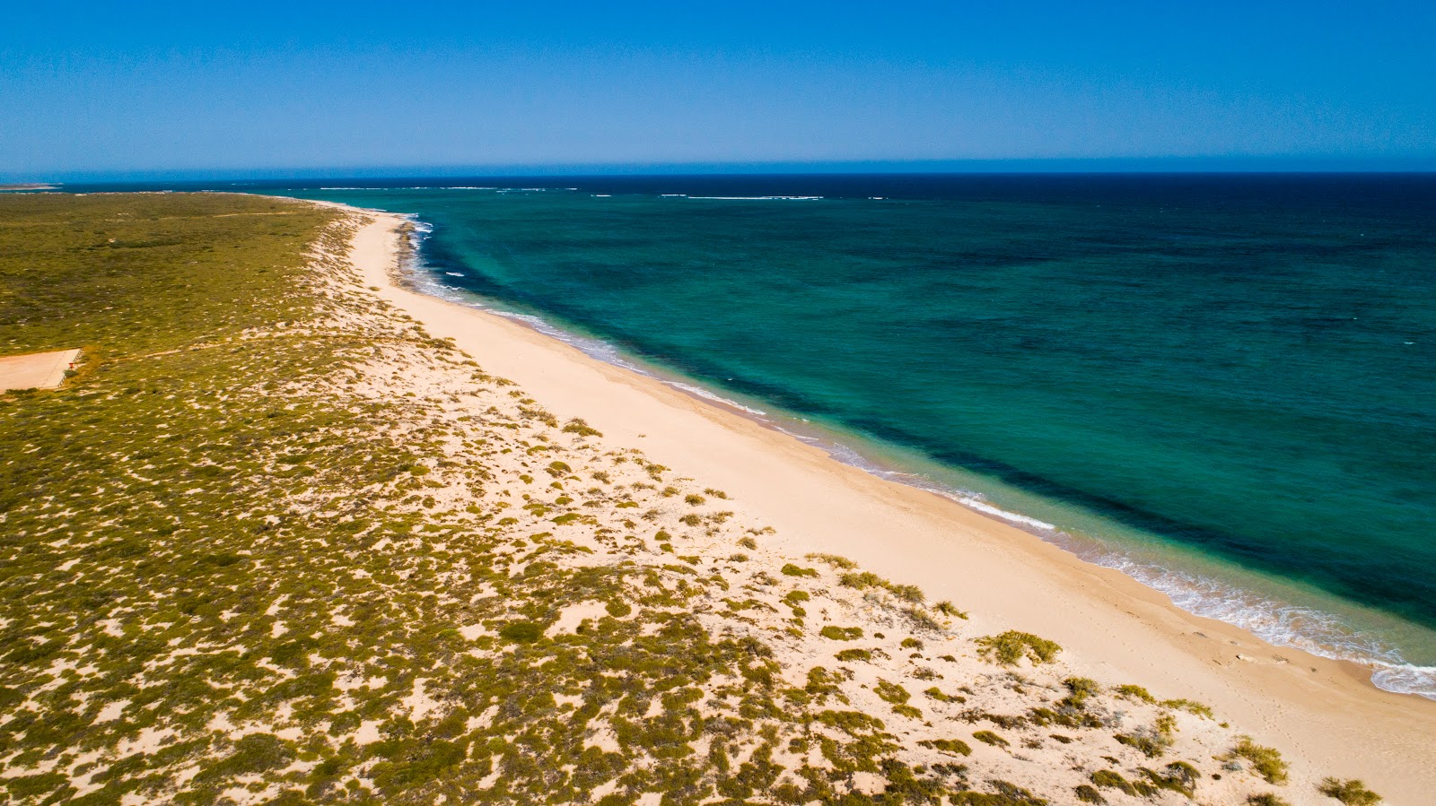 Foto van Jims Beach met recht en lang