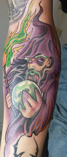 Explore mens tattoo ideas upper arm, creative tattoo ideas in Angola, available at Hoodlum Ink