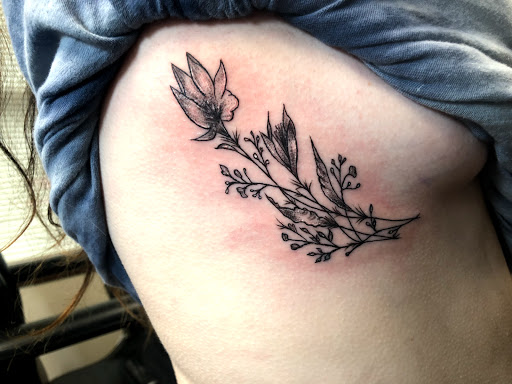 Explore dirt bike tattoo ideas, creative tattoo ideas in Charlottesville, available at Mystic Tattoo and Body Piercing