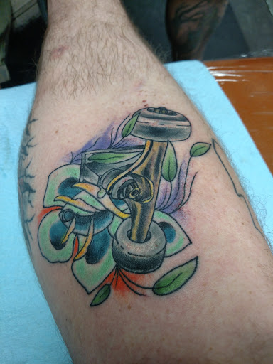 Explore bookworm tattoo ideas, creative tattoo ideas in Gadsden, available at Sacred Art Tattoo Company