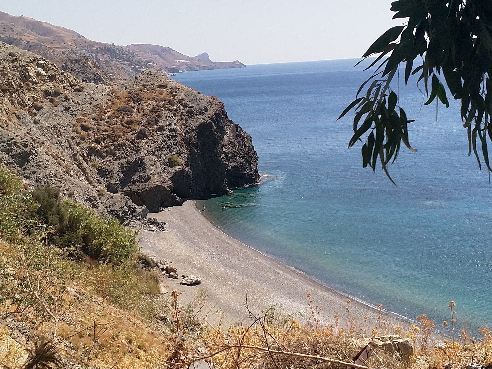 Foto av Maha beach med grå sten yta
