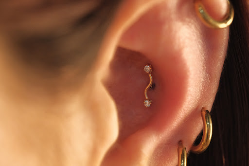 Explore black cover up tattoo ideas, creative tattoo ideas in Buffalo, available at Moria Piercing and Jewelry