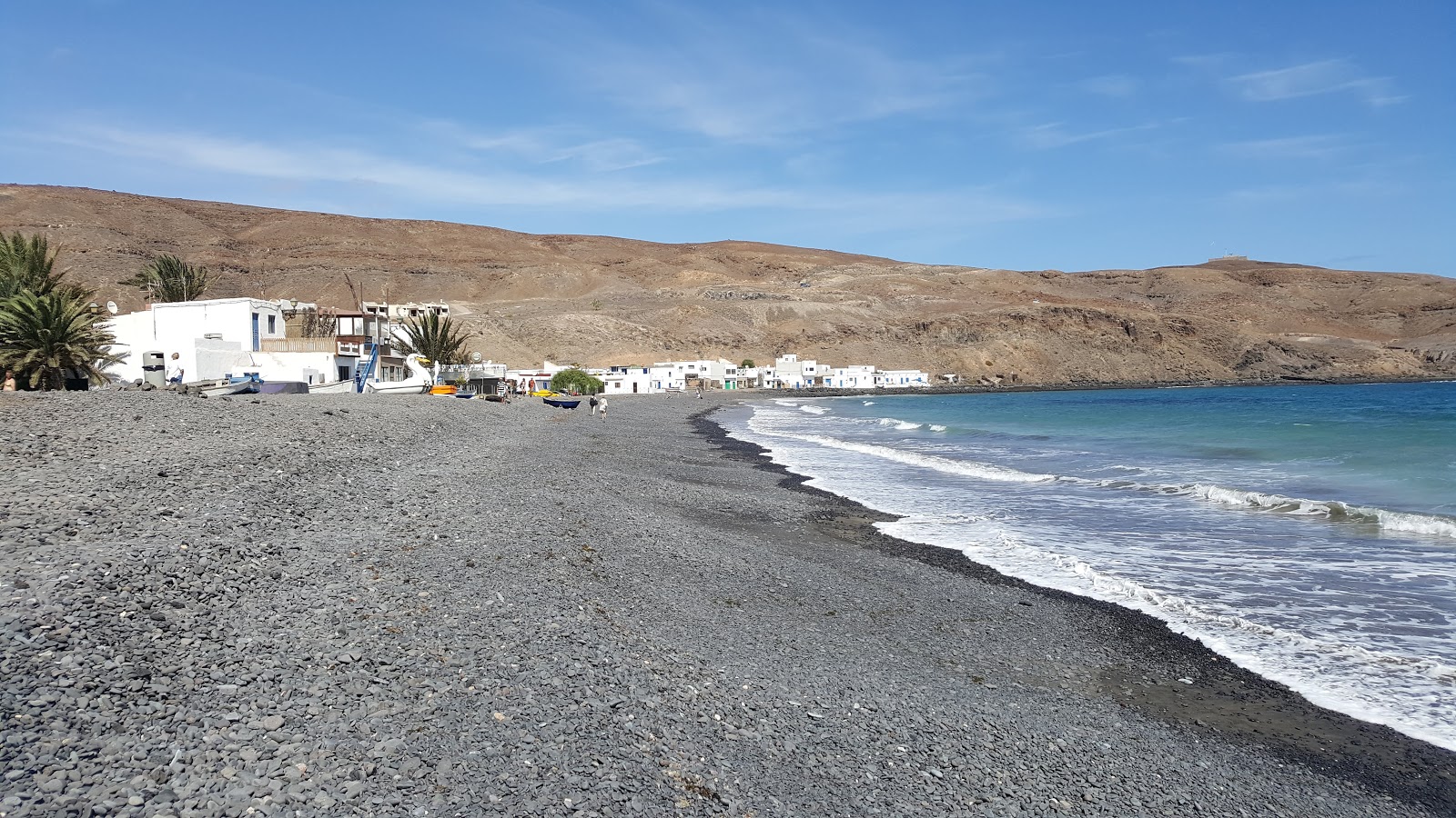 Foto de Playa Pozo Negro com areia cinza e seixos superfície