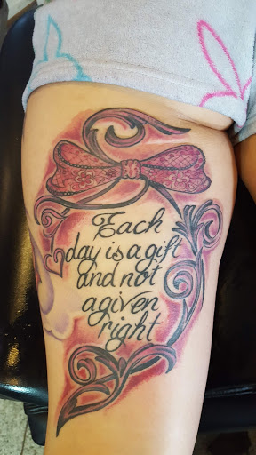 Explore religious tattoo cover up ideas, creative tattoo ideas in Grand Forks, available at Magoos tattoos and body piercing