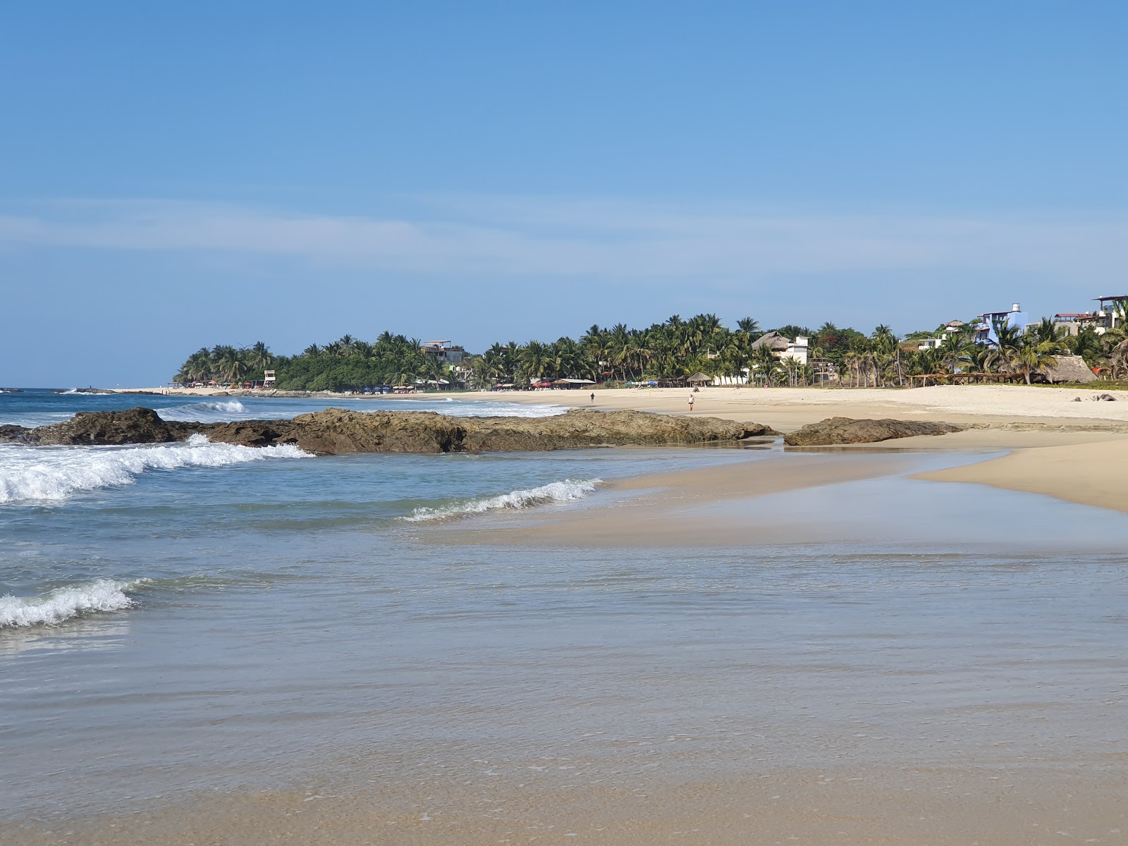 Photo de Playa Agua Blanca avec l'eau turquoise de surface