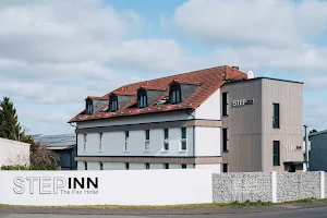 Step Inn Hotel image