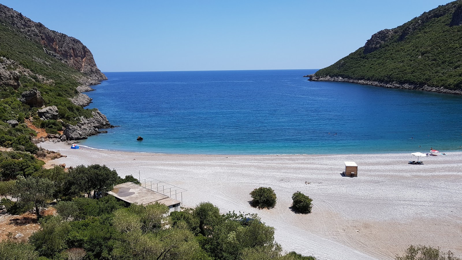 Photo of Vlychada beach with turquoise water surface