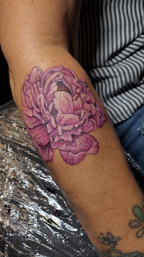 Explore rainbow baby tattoo ideas, creative tattoo ideas in San Tan Valley, available at San Tan Tattoo