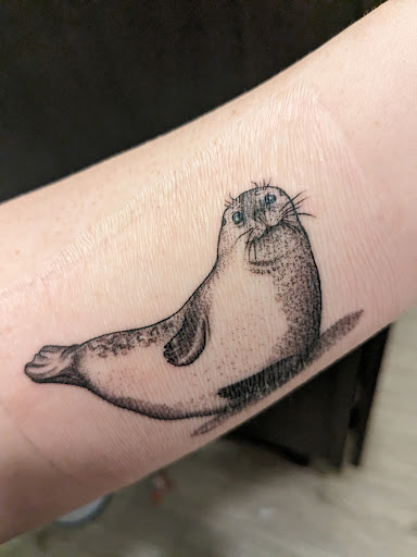 Explore book lover tattoo ideas, creative tattoo ideas in Davenport, available at Fine Ink Studios Tattoos
