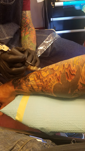 Explore hunger games tattoo ideas, creative tattoo ideas in Omaha, available at Liquid Courage Tattoos