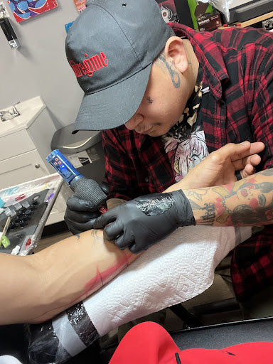 Explore man hand tattoo ideas, creative tattoo ideas in Hinesville, available at House of Ink Tattoos