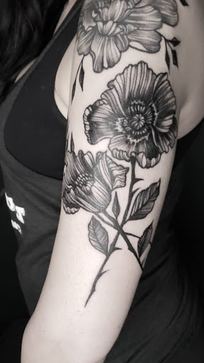 Explore motley crue tattoo ideas, creative tattoo ideas in Charlotte, available at Canvas Tattoo & Art Gallery