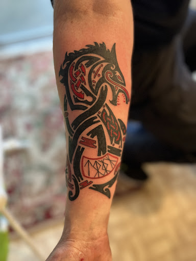 Explore man leg tattoo ideas, creative tattoo ideas in Spokane, available at Platinum Rose Tattoo Studio