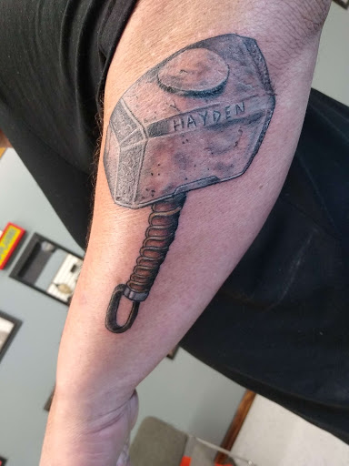 Explore fine line name tattoo ideas, creative tattoo ideas in Chester, available at Anchored Arms Custom Tattoo