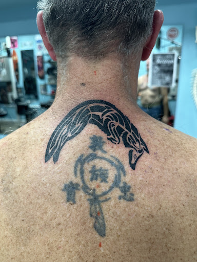 Explore crucifix tattoo ideas, creative tattoo ideas in Ocala, available at The Tattoo Gallery of Ocala LLC