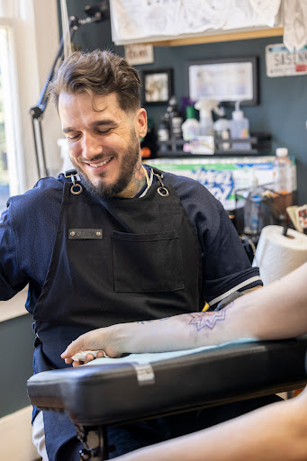 Explore feather memorial tattoo ideas, creative tattoo ideas in Seattle, available at West Seattle Tattoo