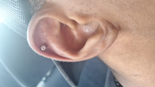 Explore teaching tattoo ideas, creative tattoo ideas in Ocoee, available at Slaughterized Ink Tattoo and Piercing Studio