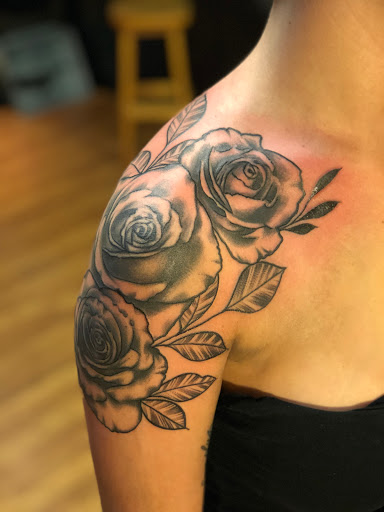 Explore flower tattoo sleeve ideas, creative tattoo ideas in East Freedom, available at Midnight Ink Tattoo Parlor