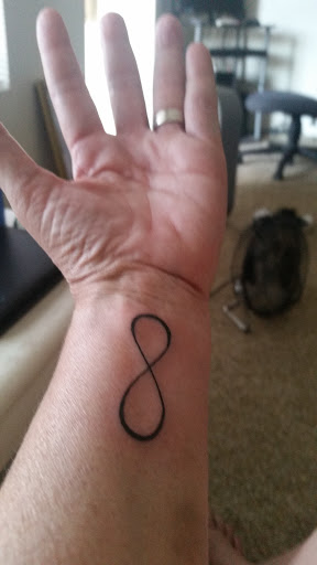 Explore dolphin tattoo ideas for females, creative tattoo ideas in Cedar City, available at Macks Tattoo Shop