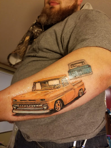 Explore club america tattoo ideas, creative tattoo ideas in Pikeville, available at The Carbon Canary Tattoo Studio