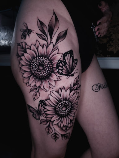 Explore beautiful flower tattoo ideas, creative tattoo ideas in College Station, available at Legacy Tattoo Lounge