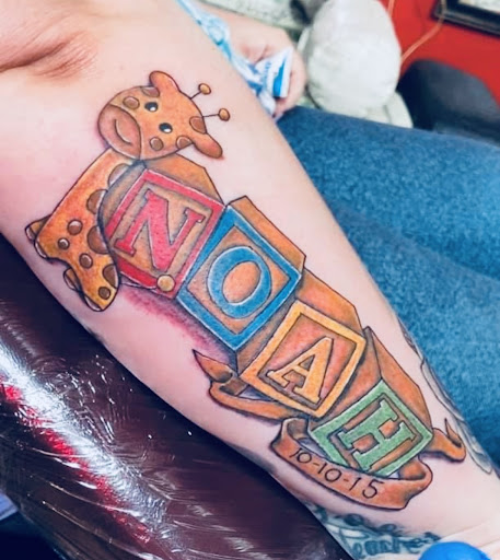 Explore chest tattoo lettering ideas, creative tattoo ideas in Midland, available at The Company Ink