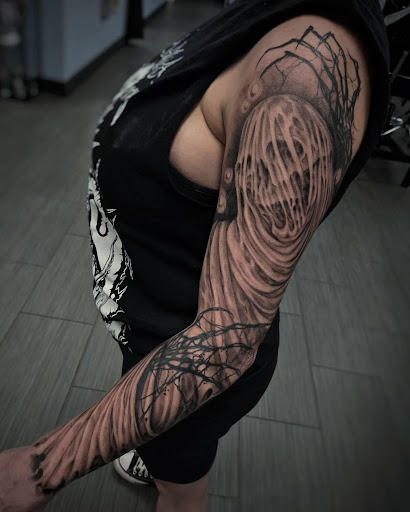 Explore tattoo ideas upper back, creative tattoo ideas in Palm Harbor, available at Angry Owl Tattoo and Piercing