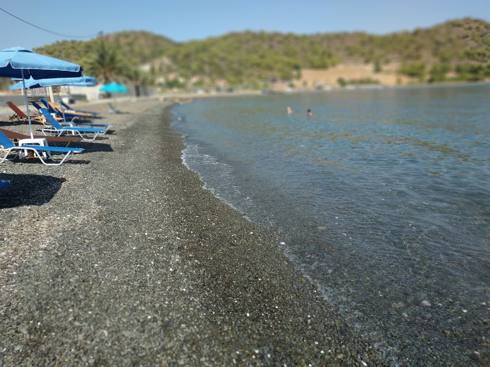 Photo de Almyra beach avec l'eau cristalline de surface