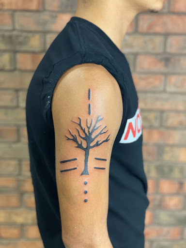 Explore sign language tattoo ideas, creative tattoo ideas in Houston, available at The Dark Anchor