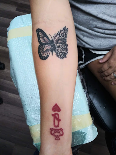 Explore cover up tattoo ideas for lower back, creative tattoo ideas in Ozark, available at Tooth & Nail Tattoo & Piercing