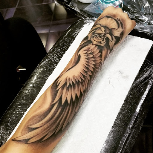 Explore money rose tattoo ideas, creative tattoo ideas in Los Angeles, available at Jackies Tattoo & Hair Design