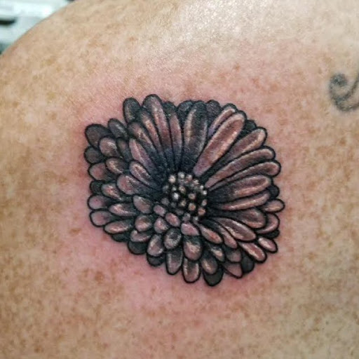 Explore tattoo on bicep ideas, creative tattoo ideas in Chapel Hill, available at Golden Falcon Tattoo and Piercing