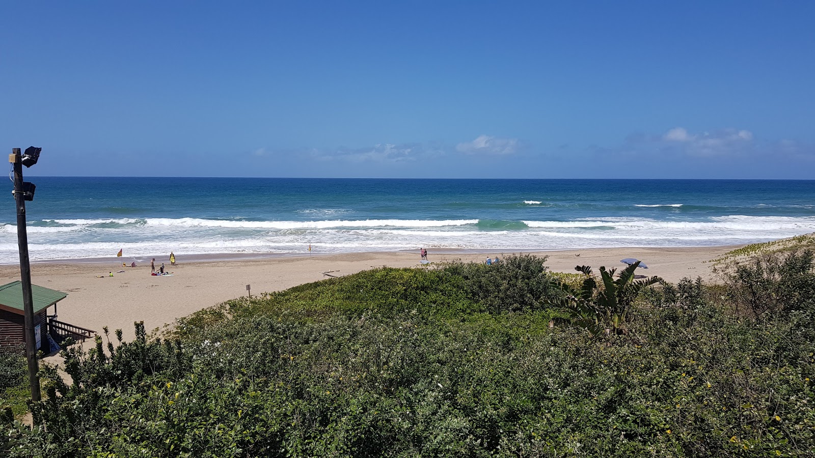 Foto av San Lameer beach med turkos rent vatten yta