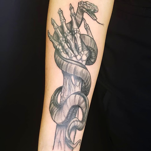 Explore love and war tattoo ideas, creative tattoo ideas in Port Saint Lucie, available at Timeless Tattoo Co