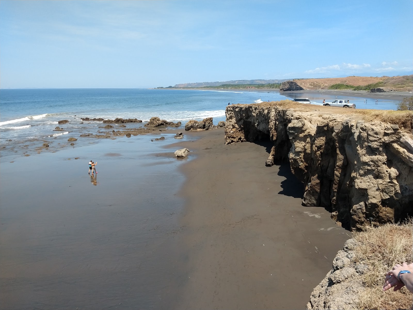 Foto van Playa Guacalillo met recht en lang