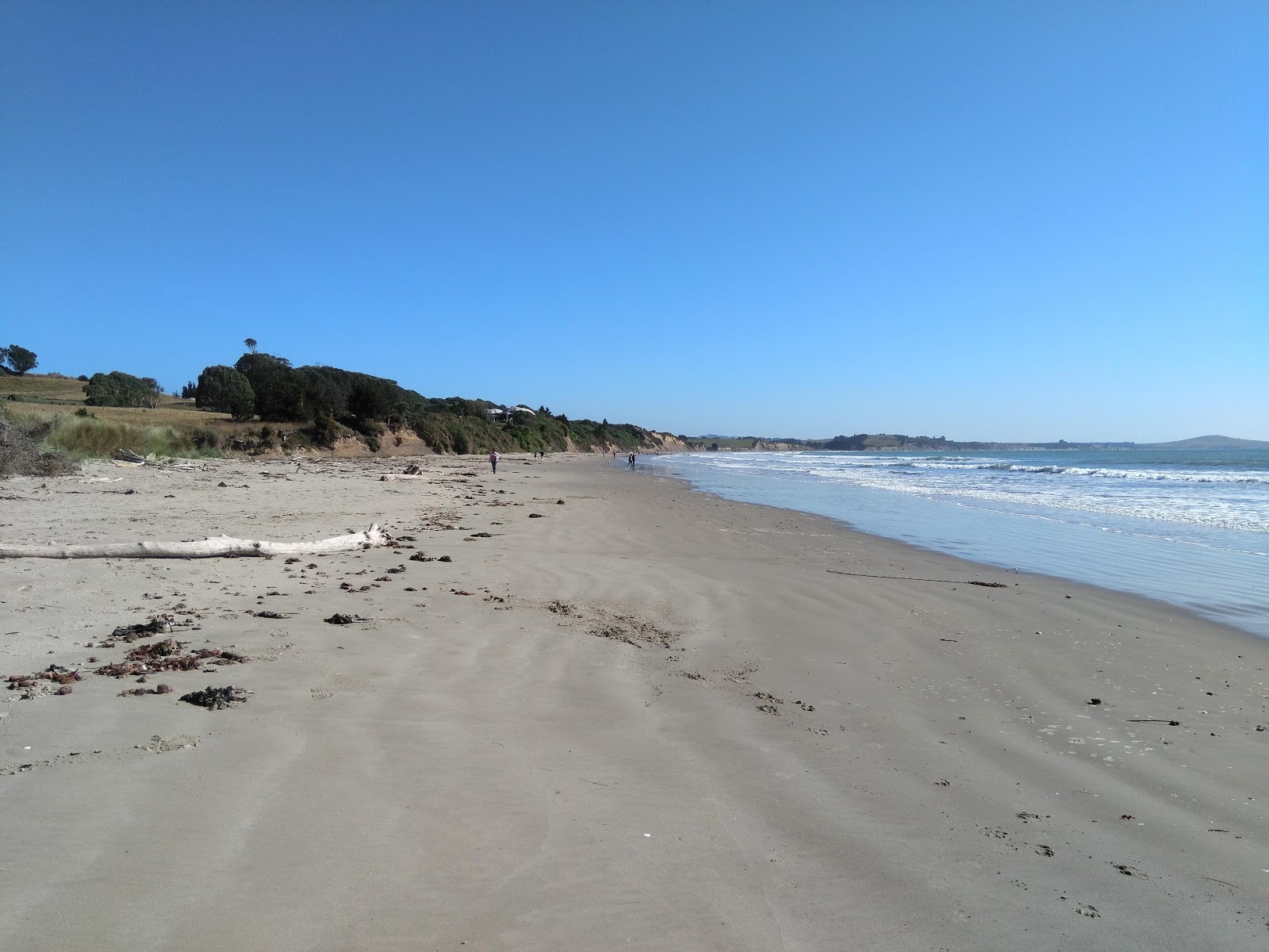 Foto van Warrington Beach met helder zand oppervlakte