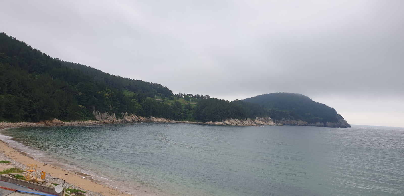 Photo of Ando Beach and the settlement