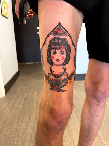 Explore feminine leg tattoo ideas, creative tattoo ideas in Palm Harbor, available at Angry Owl Tattoo and Piercing