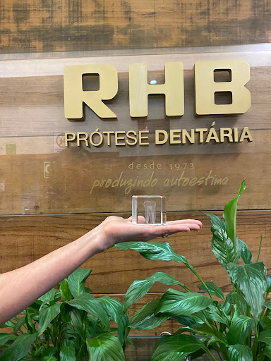 Logo da empresa - RHB Prótese Dentária