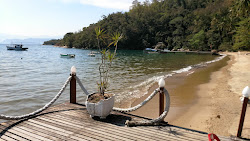 Foto von Passaterra Beach von Klippen umgeben