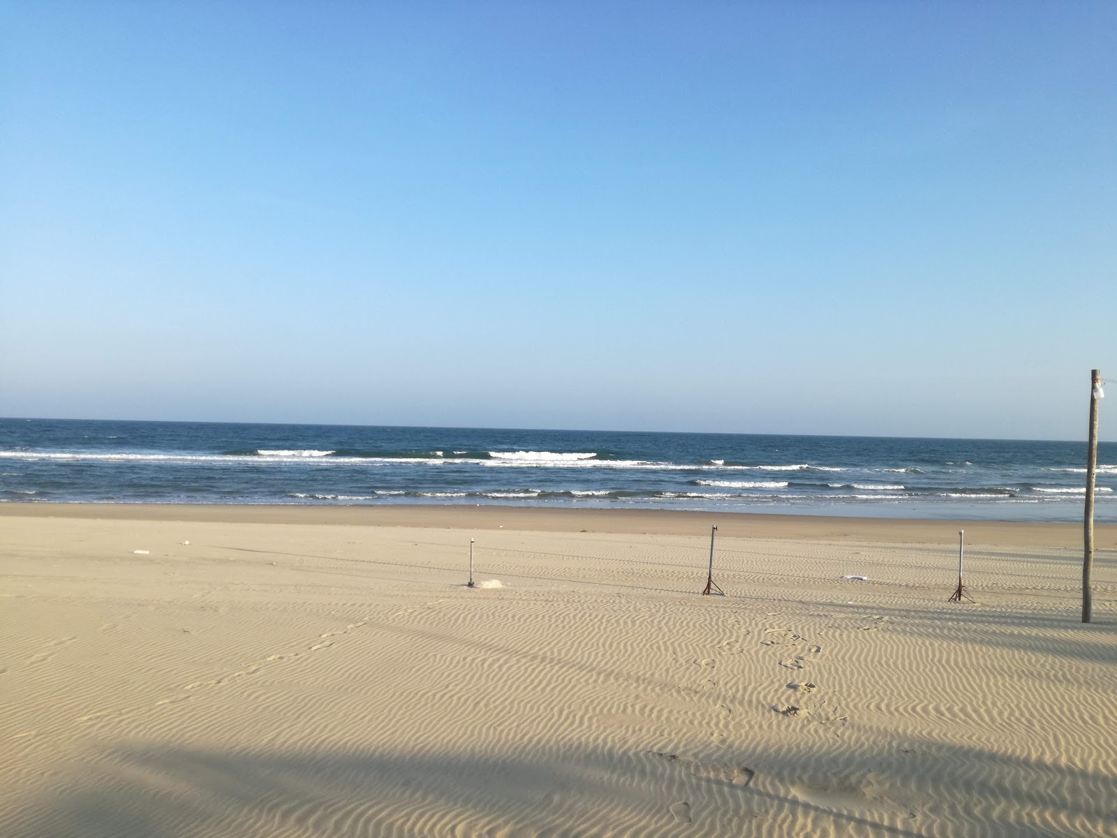 Quan Lan beach'in fotoğrafı uçurumlarla desteklenmiş