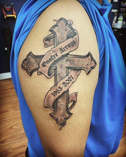 Explore guitar pick tattoo ideas, creative tattoo ideas in Cocoa, available at Rorschach Tattoo Shop and Piercing Studio